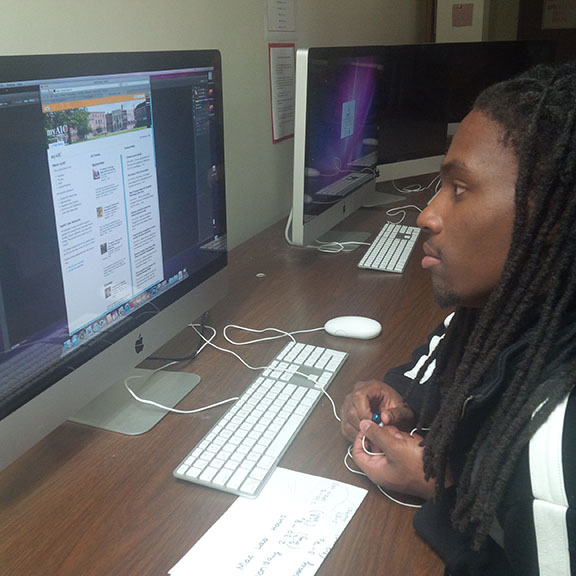 Communication student Curtis Cauley navigates his MyAIC site.