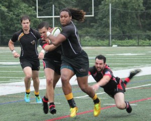 AIC Men's Rugby team runs with it.