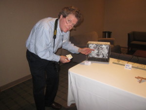 Visual and Digital Arts Professor John Nordell sets up a piece of the multi-media display.