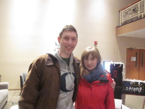 AIC graduate student Will Mortenson and friend Gwen Tunnicliffe peruse the art display.