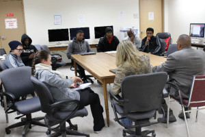 Students in Prof. DeCarlo's Communication Research class visit with City Councilor Melvin Edwards.