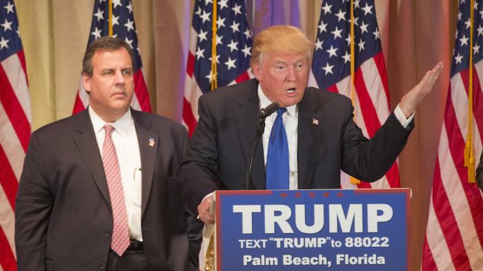 Donald Trump speaking on Super Tuesday. Trumps new minion Chris Christie looks on.