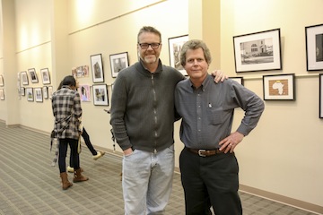 Communications professors Marty Langford and John Nordell at the art show on Tuesday, April 19.