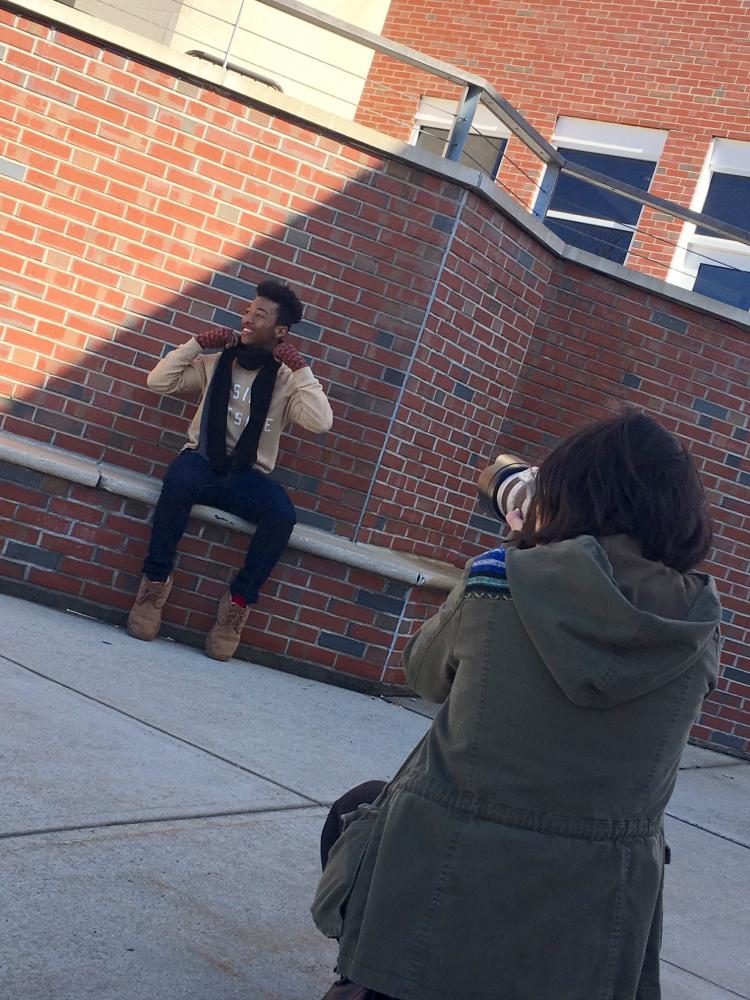 Justin Lipscomb models for a photograph as part of the mittens project.