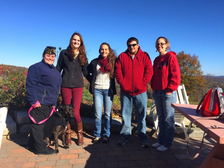 L-R: Alyssa Reardon (U.S. Air Force Veteran & President of the AIC Armed Forces Club) and service dog MJ, Allison Gavin (President of the AIC Lions Club), Jennifer Fannon (Member of the AIC Lions Club), Robby Ollari (Editor of the YJ), Janelle Fried (Treasurer of the AIC Lions Club) at the Soldiers Home in Holyoke, Mass.
