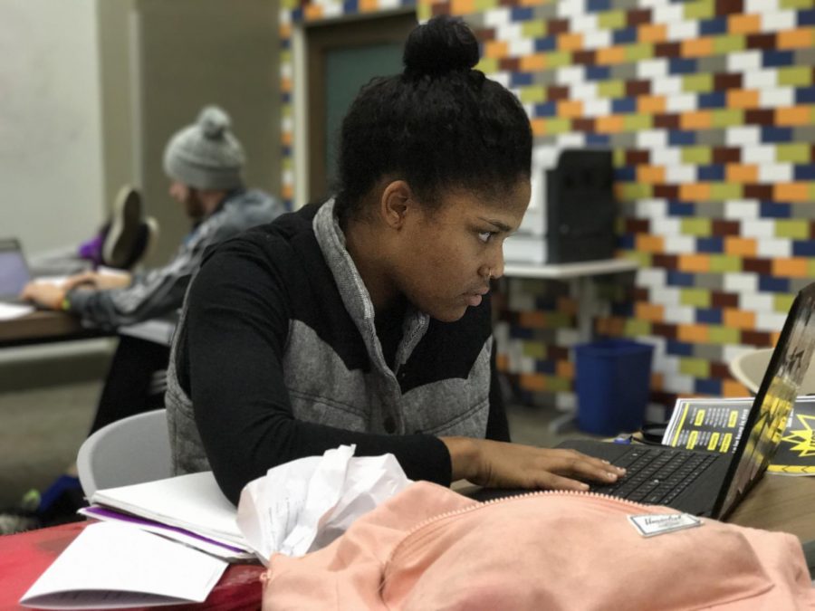 AIC student Lauren Spoon locks in on her studies as the semester winds down. 