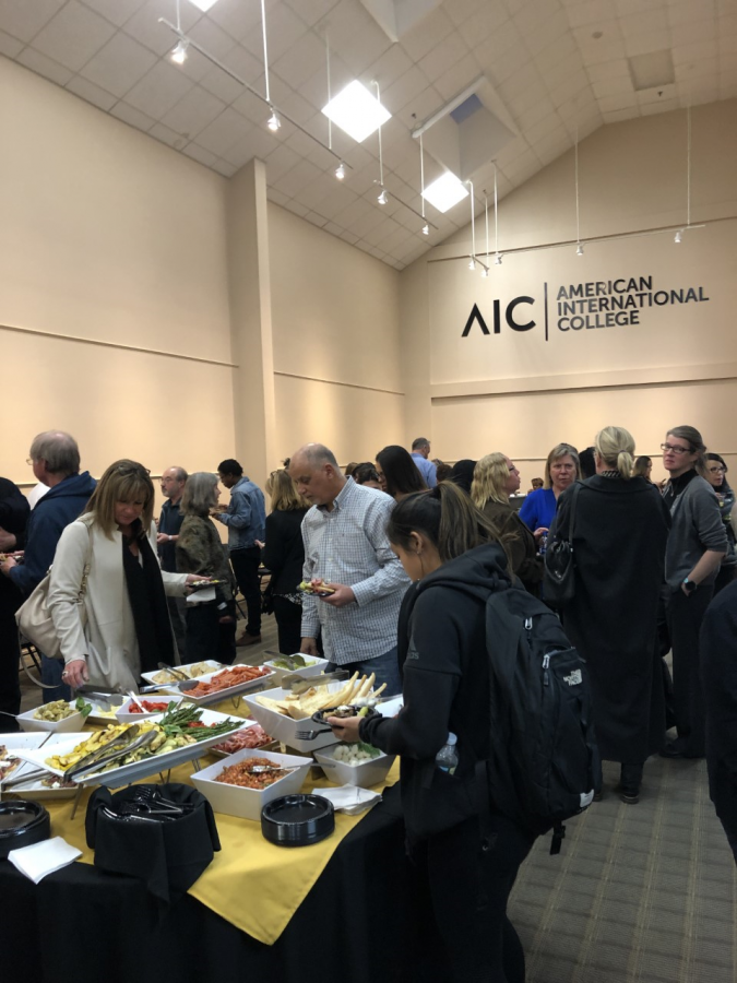 Families, students and faculty mingling at the reception after the awards ceremony.