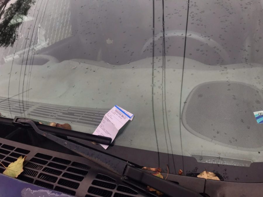 Parking tickets like this one decorate the commuter lot on campus for students who do not have the proper permits.