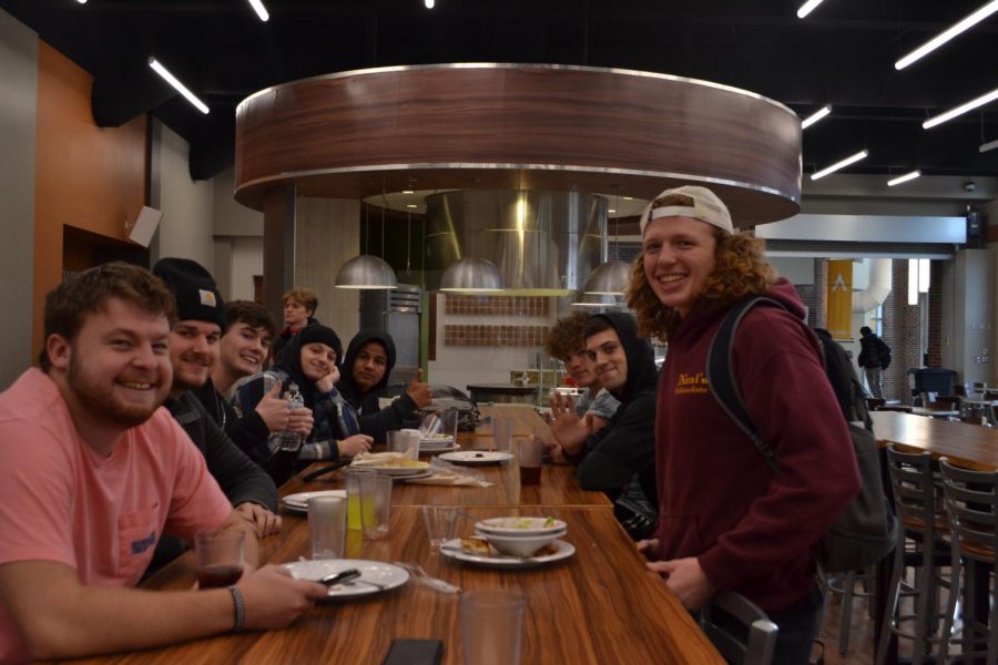 The mens lacrosse team grabs some grub in the Dining Commons after a lift.