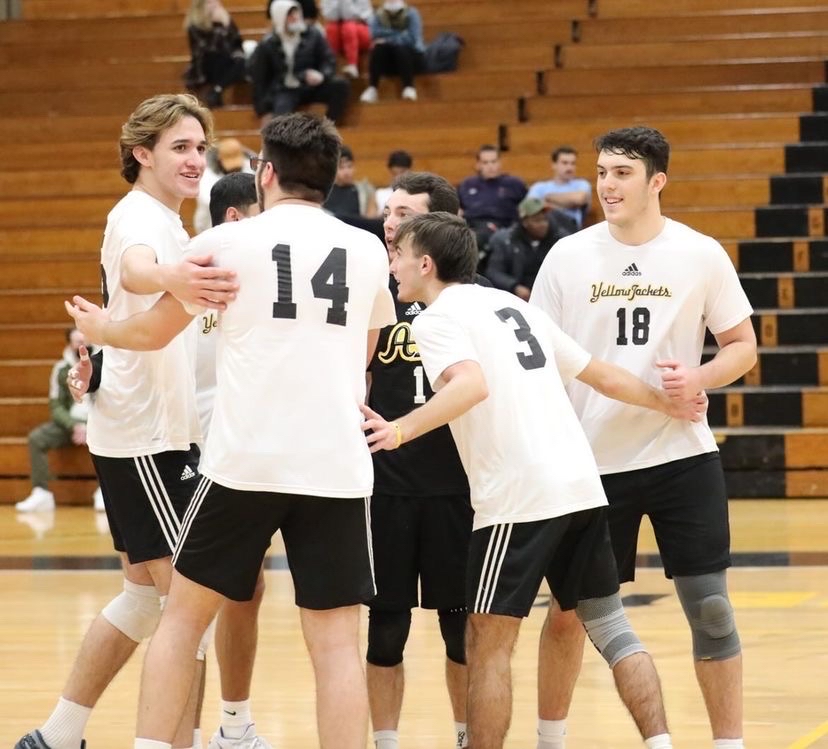 The men's volleyball team celebrates their win against the Sage Colleges on February 5.
