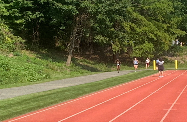 Fransiscah Cherotich finishing the Women's 5-kilometer race in 5th place.