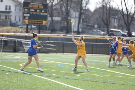 Madi Bis plays defense on Abdow Field.