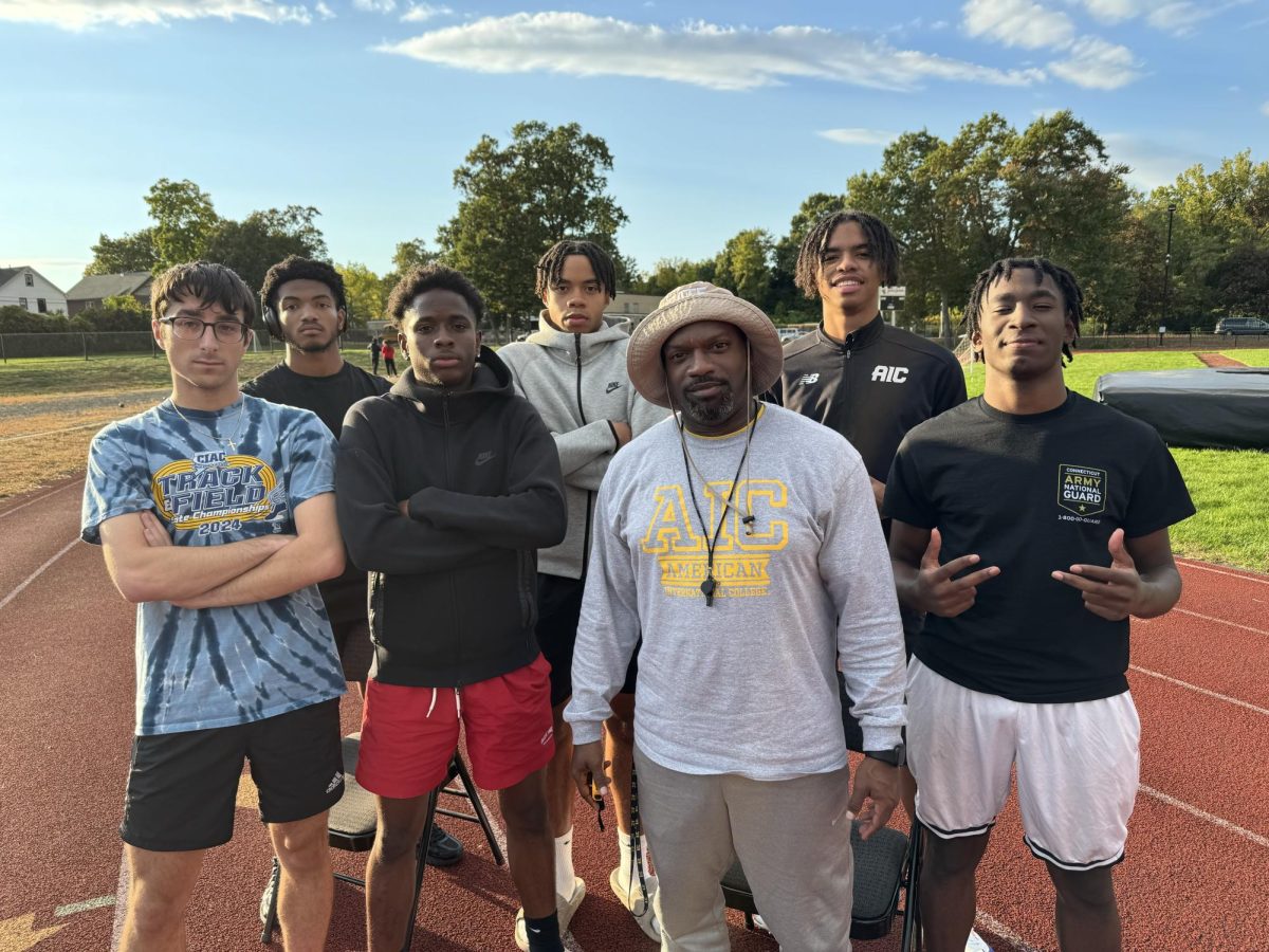 Head Coach Victor Parsley and AICs Boys Track Sprinters